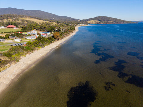 An aerial image looking south along the beach at Alonnah, Bruny Island