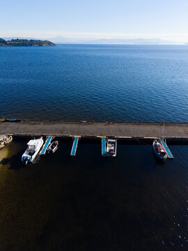 Small boats behind the jetty at Alonnah on a clear day, Bruny Island