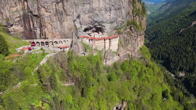 Aerial view of S&uuml;mela Monastery built into a sheer cliff above the forested Altındere Valley, showcasing the dramatic setting of this historic Greek Orthodox complex near Trabzon, Turkey