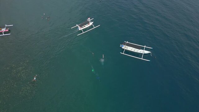 Divers Boats And Swimmers Jemeluk Bay Amed Beach Bali Indonesia Drone Shot 4K 60FPS