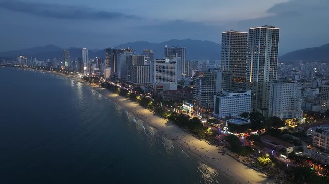 Aerial view of Nha Trang city skyline, beach scenery, and night view in Vietnam