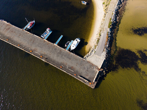 Small boats behind the jetty at Alonnah on a clear day, Bruny Island