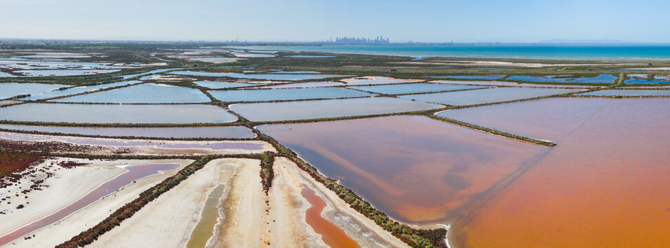 Aerial view of coastal salt evaporation pond system
