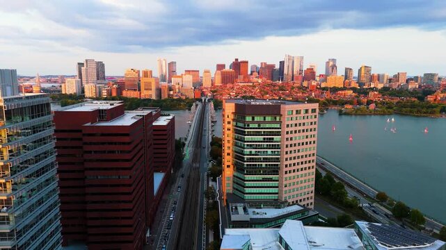 Aerial view of Longfellow Bridge spanning the Charles River with the Boston skyline in the background during golden hour in Boston, Massachusetts, United States.