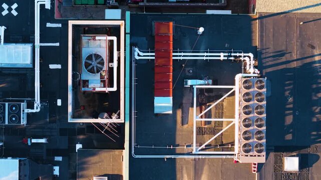 Aerial view of industrial HVAC units and ventilation systems on a flat rooftop in Boston, Massachusetts, United States.