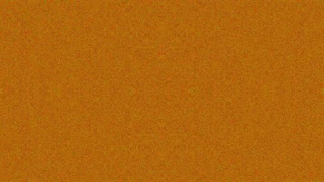 Textured orange background with grainy pattern for abstract design