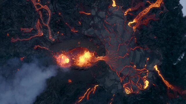 Aerial view of glowing lava flowing from an active volcanic eruption in Iceland.