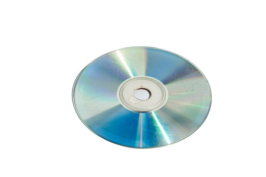 Bottom reflective surface of a heavily scratched compact disc aka CD or digital versatile disc aka DVD displaying a rainbow-like diffraction pattern and surface scuffs. Isolated on white background