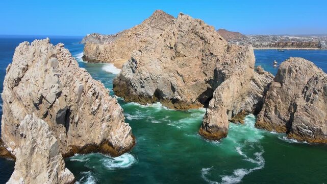 Aerial view of majestic rock formations at lands end cabo san lucas showing turquoise water and rugged cliffs in mexico.