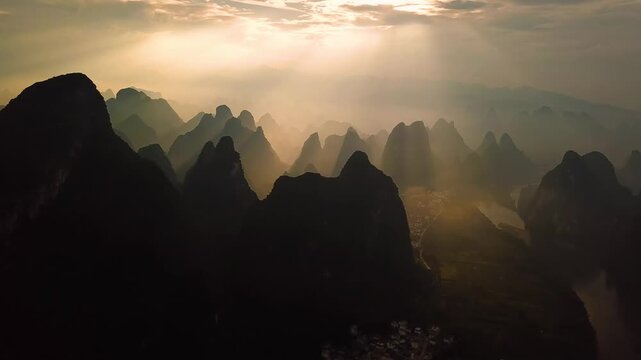 Aerial view of the karst mountains and Li River at sunset in Guilin, Guangxi, China.