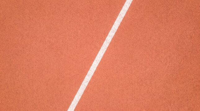 White lane marker divides a textured reddish orange running track surface