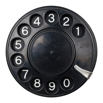 Black rotary telephone dial with white numbers and metal finger stop isolated on a transparent background