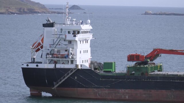 Side View of an Aggregates Carrier Vessel Ship. A specialised bulk cargo vessel designed to transport construction materials like crushed stone, sand, gravel, and shingle.