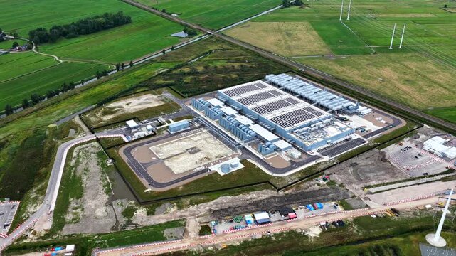 Aerial view of the Google Data Center facility surrounded by green fields and infrastructure in Groningen, Groningen, Netherlands.