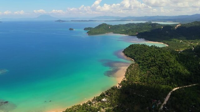 Aerial view of the tropical coastline and turquoise waters of Port Barton in San Vicente, Mimaropa, Philippines.
