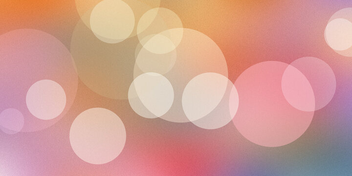 Abstract bokeh background featuring warm orange and pink circles creates a soft decorative effect for creative designs.