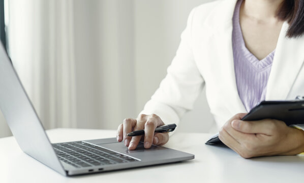 Businesswoman Reviewing Resumes for Recruitment and Hiring Candidates, Analyzing Applicant Information Before Job Interviews in Human Resources and Corporate Office