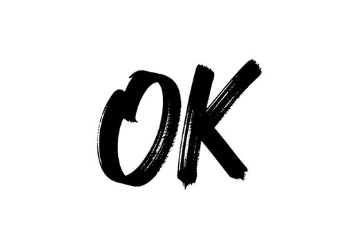 Handwritten black ink brush stroke lettering spelling the word ok isolated on white background