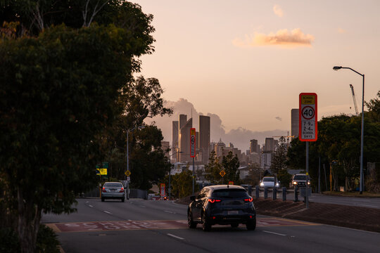 40 km/h speed limit sign in a school zone suburban street at sunset