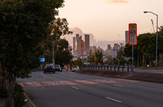40 km/h speed limit sign in a school zone suburban street at sunset