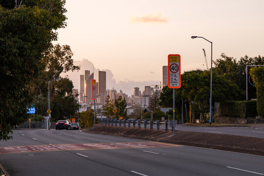 40 km/h speed limit sign in a school zone suburban street at sunset