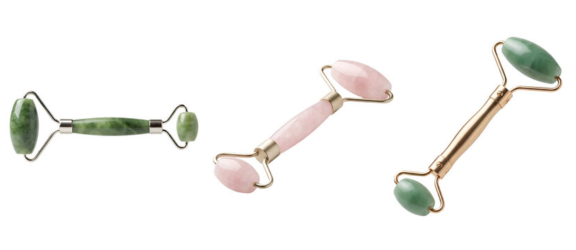 Three facial rollers made of jade and rose quartz on a transparent background for skincare and beauty routines