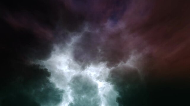 Dramatic storm clouds moving across dark night sky with intense lightning flashes cinematic motion.