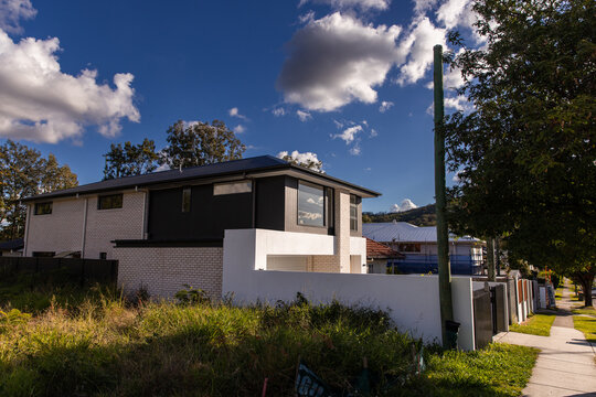 brand new house built in the suburbs on a sunny day
