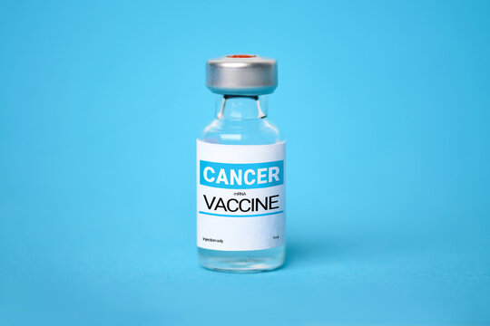 Small medical vial with mRNA cancer vaccine on blue background