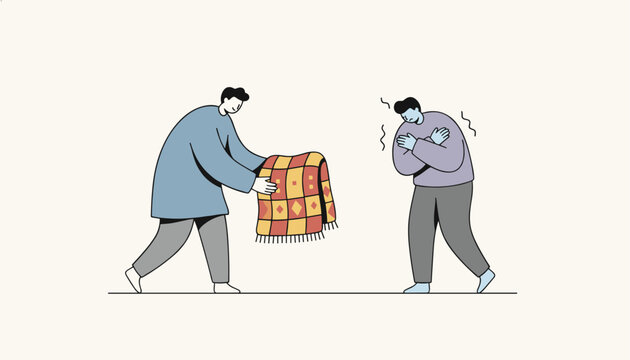 Kind man offering a warm patterned blanket to another shivering person to help protect him from the cold weather.