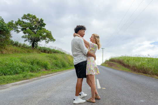 Mixed race couple hugging and in love