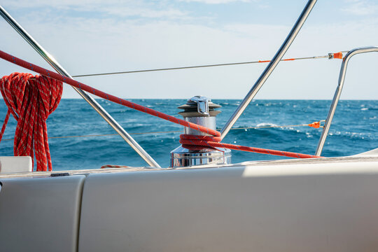 Sailboat Winch and Red Rope Yacht detail. Yachting concept.