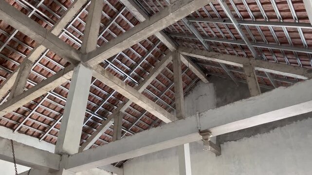 Underneath View of Light Steel Roof Framing and Terracotta Tiles