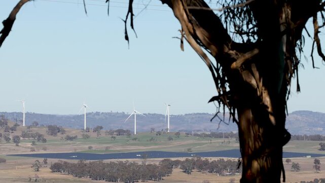Wind Turbines Spinning on Rural Hills in New South Wales Australia