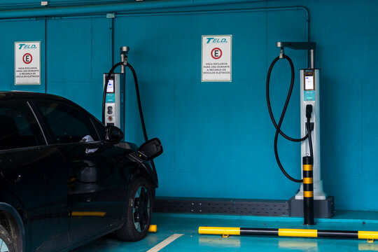 Facade of an ultra-fast electric vehicle charging station with electric cars parked in the charging bays, in the Vila Mariana neighborhood, in the southern zone of S&atilde;o Paulo. 