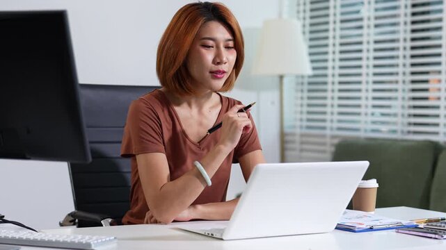 Business concepts, women working in the work area with tablet and data sheets at the desk.