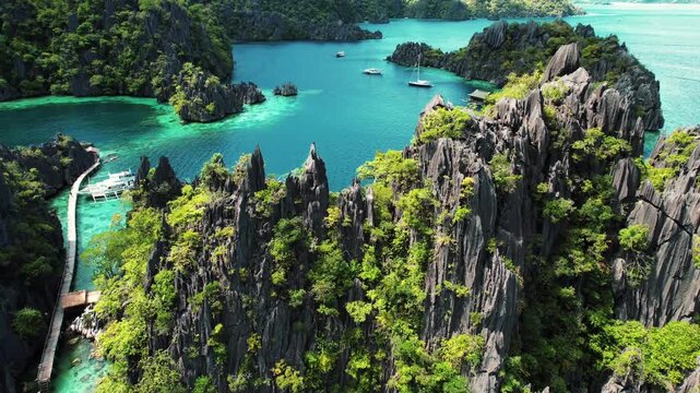 Aerial view of limestone karst formations and turquoise lagoon in Coron Palawan Philippines.