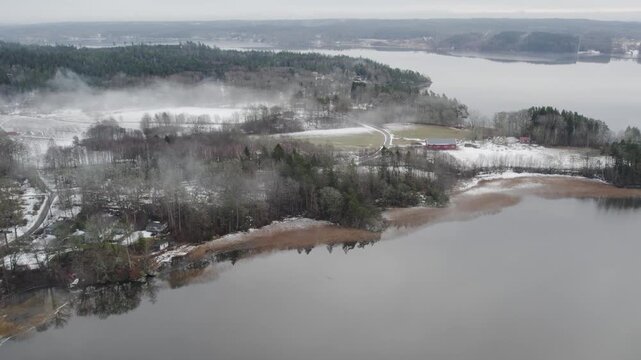 Aerial view of Lake Anten shoreline and snowy landscape near Grafsnas in winter