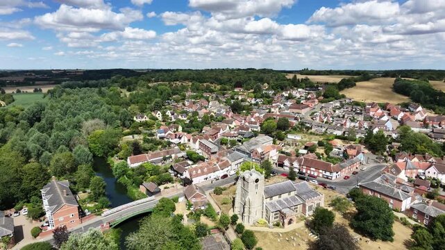 Pull back drone aerial reverse reveal Bures Village Suffolk UK