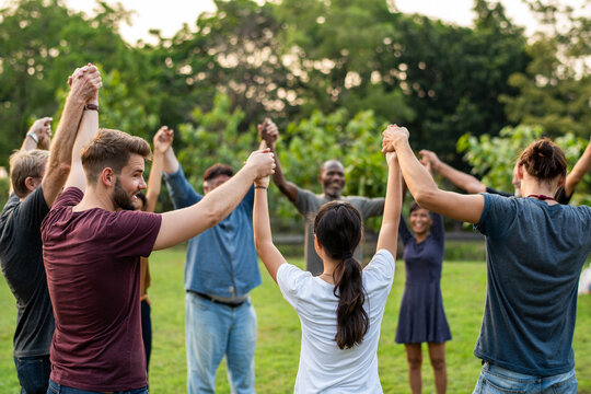 Diverse group celebrating unity outdoors