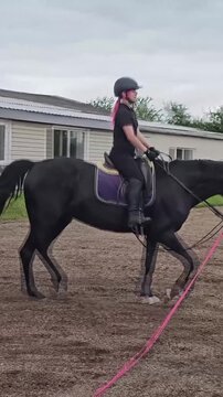 Rider practices skills while riding a horse at a training center in Ireland