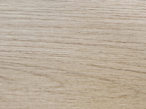 High resolution full frame background texture of light natural oak wood panel with fine horizontal grain patterns for modern interior design and architectural mockups.