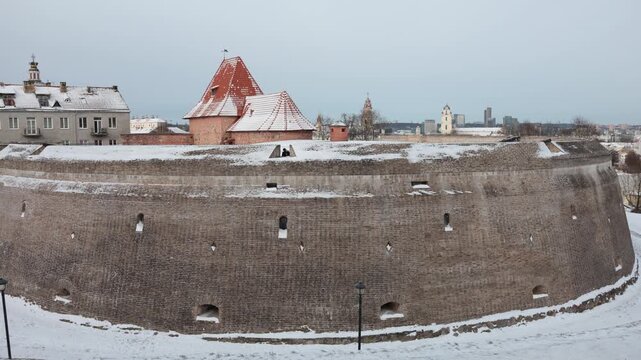 Bastion Vilnius Defensive Wall, dusted with snow, is powerful medieval defensive structure, fortifications of northern European principalities and kingdoms 
