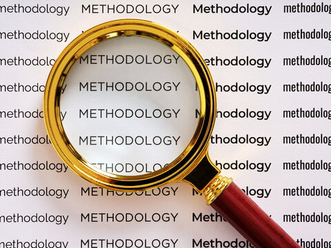 Magnifying glass focusing on methodology research and analysis