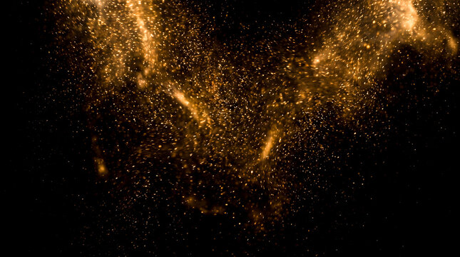 Beautiful golden glowing particles floating dynamically across solid black backdrop creating magical sparkling light trails resembling tiny vibrant cosmic stars shining brightly