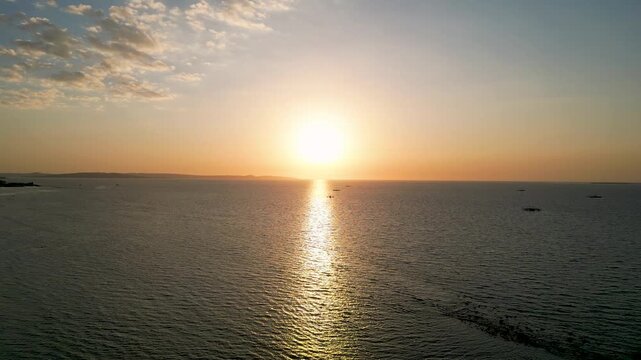 Aerial view of Kelapa Lima Beach coastline in Kupang, East Nusa Tenggara, Indonesia during golden hour.