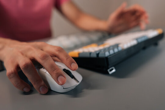 Close-up of unrecognizable person testing ergonomic wrist rest pad in cloud shape, providing comfort and support for keyboard and mouse use, enhancing workspace well-being and productivity.