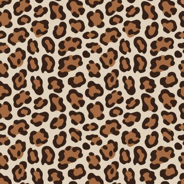 A seamless pattern of leopard spots on a beige background