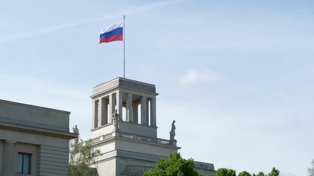 Russian flag flying atop rooftop pavilion at Embassy of Russia in Berlin