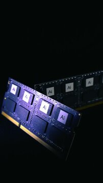 Modern AI computer memory chips on a circuit board slowly spinning with purple lighting. Concept for artificial intelligence, machine learning, deep learning, and futuristic technology